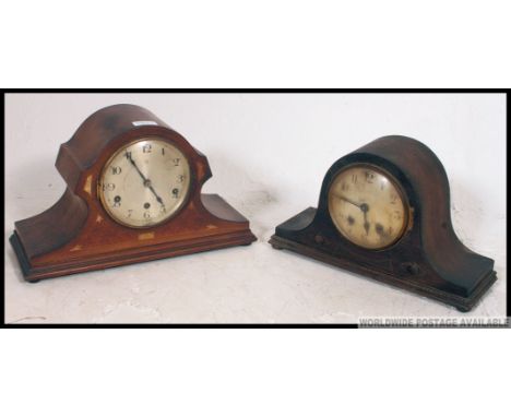An early to mid 20th century Hamburg and America oak cased mantle clock along with another similar clock