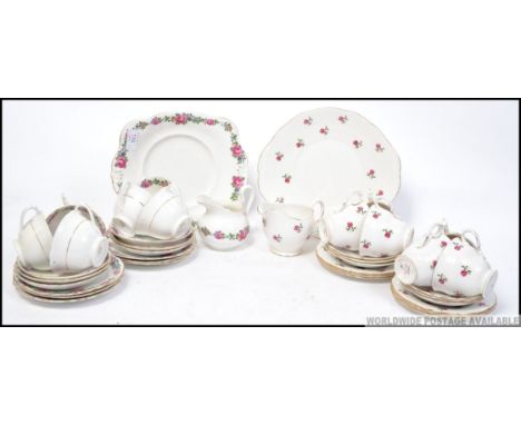 A Colclough chintz pattern part tea service together with a similar Tuscan china part service. To include cups, saucers, crea