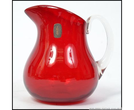 An original retro mid century Whitefriars cranberry glass pitcher jug with clear glass handle, Retaining the original Whitefr