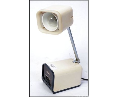 A retro 1970s/ 1980's Pierre Cardin Pifco metamorphic bedside lamp with telescopic light