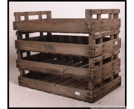 A group of vintage wooden apple / fruit transportation crates along with a metal wire work bread crate