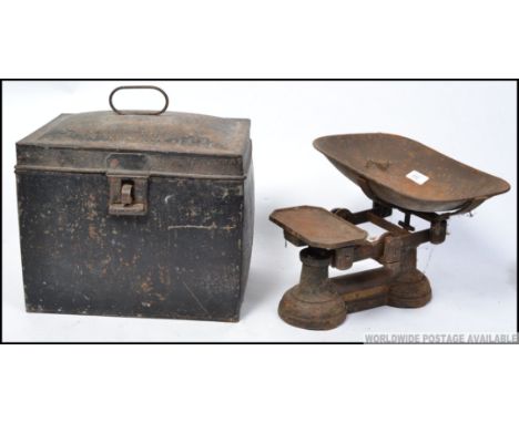 A Victorian cast iron set of balance scales by Day and Millward Birmingham with weights along with a metal rectangular hat bo