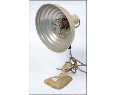 A vintage mid century Pifco heat lamp, having a cast metal adjustable base ideal for conversion to a desk lamp
