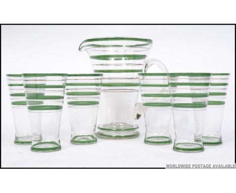 A stunning retro mid century lemonade set comprising green banded glasses and matching pitcher jug. H22cm 