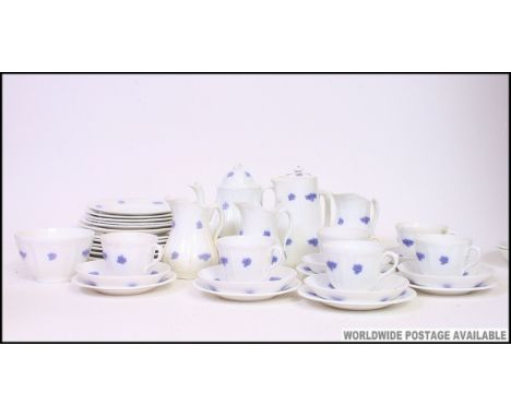A 20th century Staffordshire blue and white tea service by Adderley  in the Wedgwood style. Comprising teapot, water pout, cu