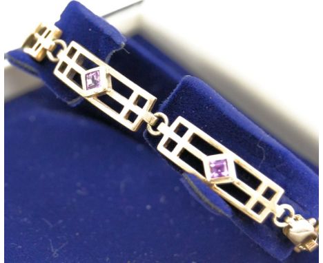 A Charles Rennie Mackintosh inspired 925 stamped silver bracelet,  formed by rectangular openwork links each set with a singl