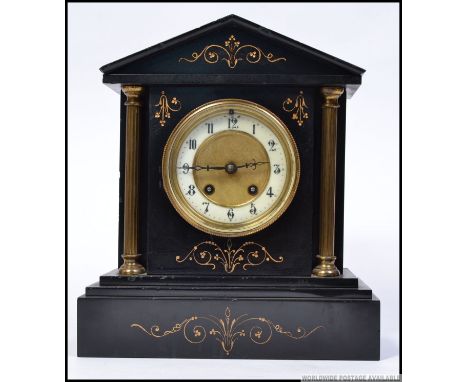 A late 19th century Victorian column mantle clock having gilt decoration, eight day movement and striking on a bell.