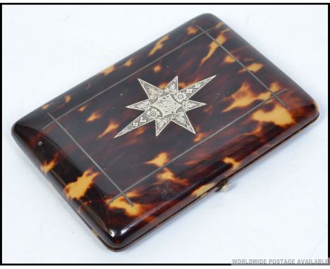 A stunning silver inlaid tortoiseshell aide de memoir case with beautiful appointed interior with sectional centre. The silve