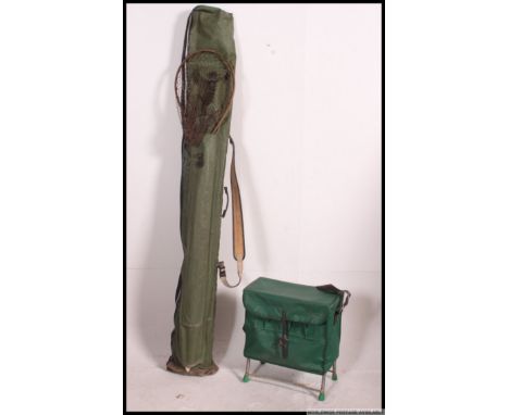 A collection of vintage fishing rods and equipment, to include cane, split cane rods from during the wars, umbrella, vintage 