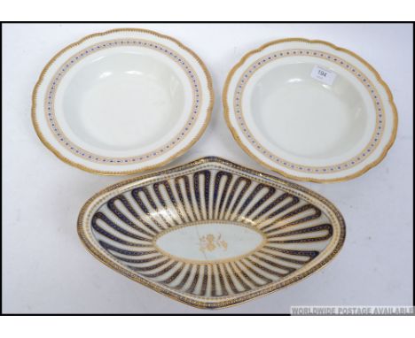 A pair of Grainger and Co 19th century Worcester dishes having applied gilt edge, with a geometric border stamped to the base