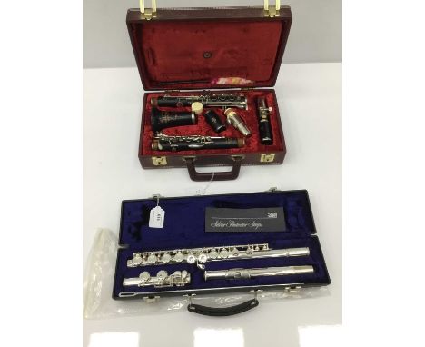 Earlham silvered flute, cased, as new condition, together with Rudall Carte / Boosey and Hawkes clarinet, cased. (2)