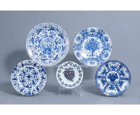 Full title: Four Dutch Delft blue and white chargers and a polychrome plate with floral design, 18th C.Description: Dia.: 39 