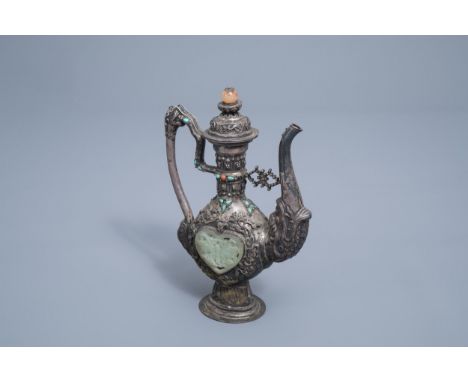 Full title: A coral, jade and turquoise inlaid silver ewer and cover, Tibet, 19th/20th C.Description: H 23,3 cmÊ Total weight