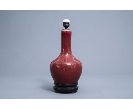 Full title: A Chinese monochrome sang de boeuf lamp-mounted bottle vase, 19th C.Description: H 39,5 cmCondition:Please contac