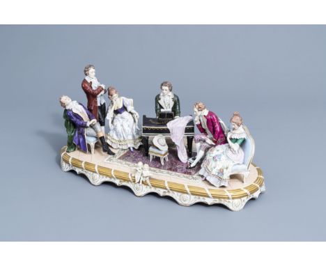Full title: A group with a piano concerto in polychrome decorated Saxon porcelain, Sitzendorf mark, 20th C.Description: H 27,
