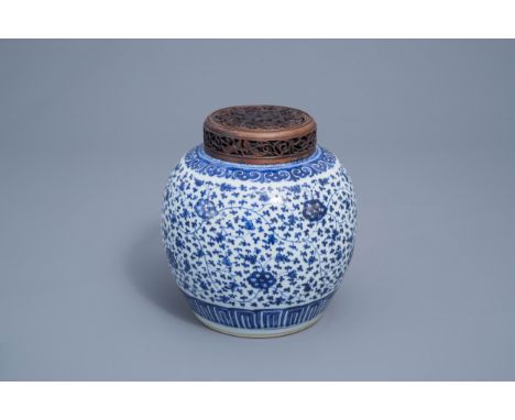 Full title: A Chinese blue and white 'lotus scroll' jar with wooden cover, QianlongDescription: H 25 cmCondition:Please conta