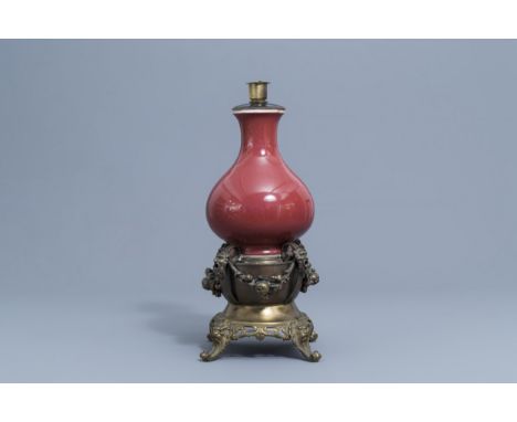 Full title: A Chinese monochrome sang de boeuf lamp-mounted bottle vase, Qianlong mark and probably of the periodDescription: