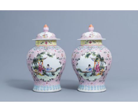Full title: A pair of Chinese famille rose vases and covers with ladies playing music and reading, Qianlong mark, 20th C.Desc