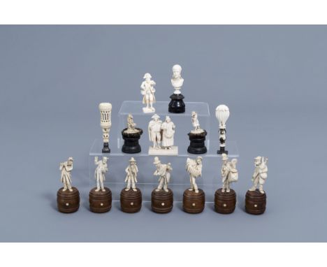 Full title: A French seven-piece ivory orchestra and seven different sculptures and stamps, 19th/20th C.Description: H 12,1 -