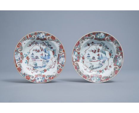 Full title: A pair of Chinese deep famille rose plates with figures in a landscape and cranes, Yongzheng/QianlongDescription: