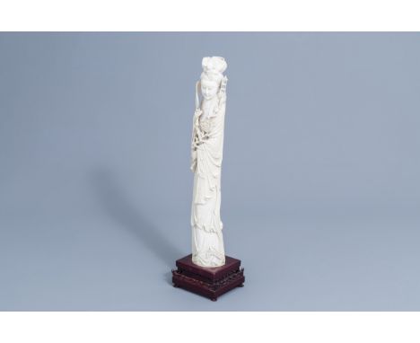 Full title: A large Chinese carved ivory figure of a lady on a wooden base, first half of the 20th C.Description: H 59,7 - 57