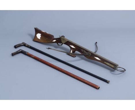 Full title: A French Druell(e) crossbow, Douai, and two walking sticks, which can be used as a pistle, 19th/20th C.Descriptio