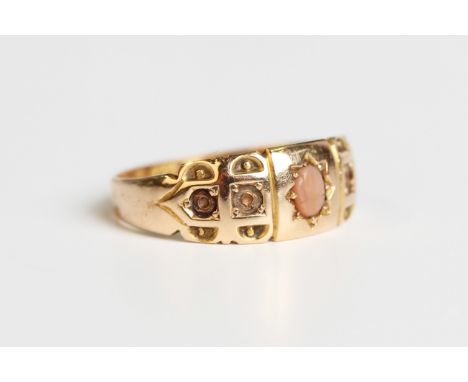 A late Victorian 15ct gold ring, mounted with an oval coral, Birmingham 1895, weight 2.6g, ring size approx M1/2 (two pairs o