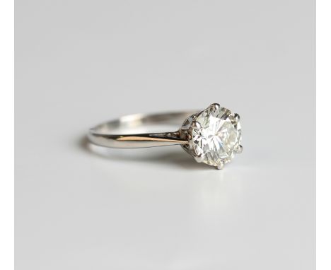 A platinum and diamond single stone ring, claw set with a circular cut diamond, detailed 'Platinum', ring size approx M, with