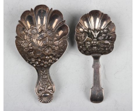 A George IV silver caddy spoon, the lobed oval bowl embossed with flowers and fruit, the handle with scallop shell terminal, 
