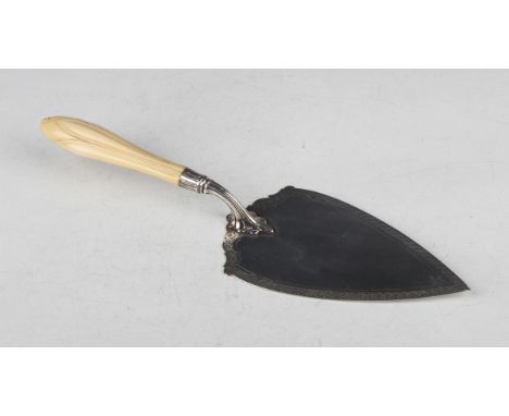 A Victorian silver presentation trowel, the blade engraved with a Celtic style band, the underside with engraved inscription 