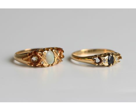 An 18ct gold ring, mounted with an oval opal with two pairs of diamond points, Birmingham 1918, ring size approx L (two furth