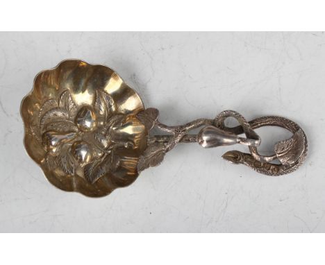 A mid-Victorian silver caddy spoon, the gilt lobed circular bowl embossed with fruit, the handle modelled as a fruiting stem,
