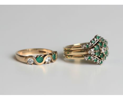 A 9ct gold, diamond and emerald cluster ring, claw set with the principal circular cut diamond to the centre with diamond thr