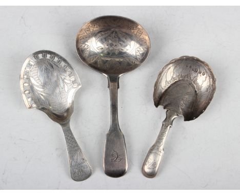 A George IV silver Fiddle pattern caddy spoon, the oval bowl engraved with a flower stem within a leaf border, London 1829 by