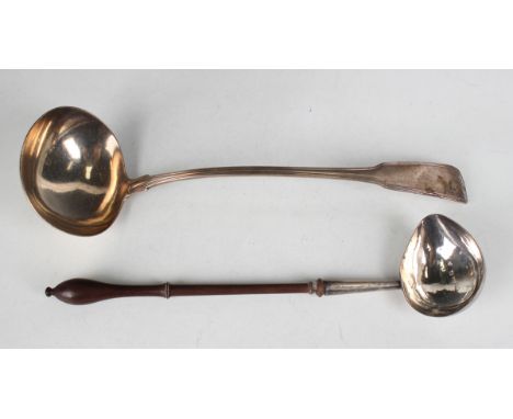 A George II silver punch ladle with turned wood handle, London 1744 by David Hennell, length 29cm, and a George III silver Fi