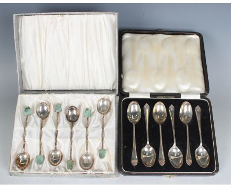 A set of six Chinese sterling coffee spoons, each simulated bamboo stem with carved jade Buddha finial, each marked 'Sterling
