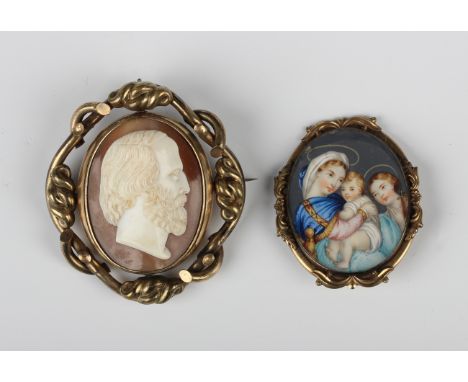 A Victorian gilt metal shaped oval brooch, glazed with a portrait of the Madonna and Child, width 4.1cm (the pin lacking), an