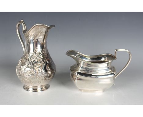 A Victorian silver baluster milk jug, chased and engraved with flowers, 'C' scrolls and scale filled panels, London 1842, hei