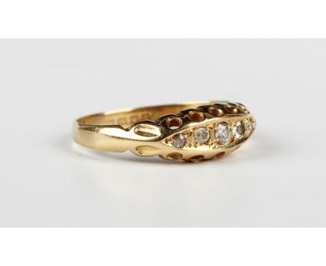 An 18ct gold and diamond ring, mounted with a row of five graduated cushion cut diamonds in a boat shaped setting, London 191