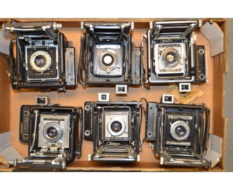 A Tray of Six Miniature Press Cameras, including Speed Graphic (2) a Busch Pressman, a Tower Press, Graflex Century Graphic a