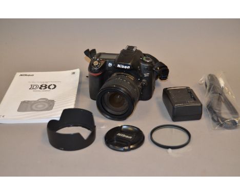 A Nikon D80 SLR Digita Camera, with AF-S Nikkor 18-70mm f/3.5-4.5 G zoom lens, body G, elements G,with charger and manual 