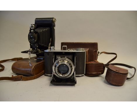 An Olympus Six II Folding Camera, with Zuiko 7.5cm f/2.8 lens, Leitz screw on shutter button, shutter working, body G, elemen