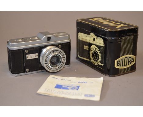 A Radix Bilora Camera, with Biloxar 38mm f/5.6 lens, shutter working, body F-G, elements G, manual, in original metal box 