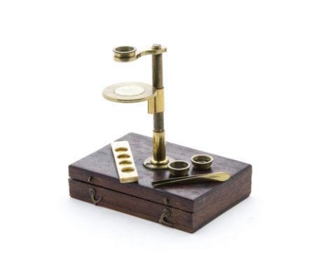 An early 19th Century Banks-type lacquered brass Simple Pocket Microscope,  with three stackable lenses, circular stage with 