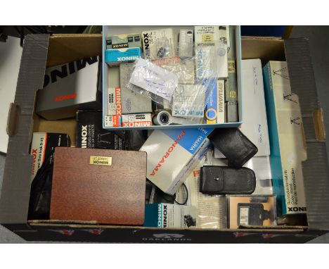 A Quantity of Minox Accessories, incl; flash units, binocular attachment, tripod, filters, film stock, windwatch-pro, literat