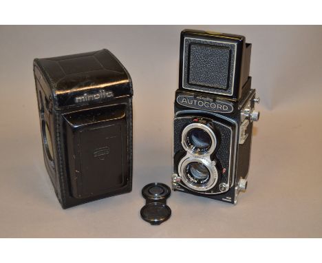 A Minolta Autocord RA TLR Camera, with 7.5cm f/3.5 Rokkor lens, shutter working, body G-VG, elements G, in leather case 