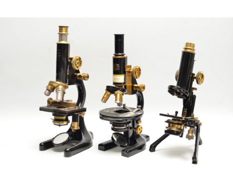 Lacquered brass and black-enamelled Compound Monocular Microscopes,  W Watson & Son, with folding tripod base, some overpaint