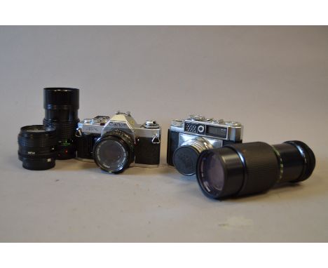 A Canon AV-1 Outfit, with 50mm f/1.8 FD, 50mm f/2.8 FD, Vivitar 60-200mm f/4.5 lenses, filters, flash bracket, manuals and a 