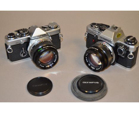Two Olympus OM SLR Cameras, An Olympus OM-2n and an OM-10 and manual adapter, both with Zuiko Auto-S f/1.4 50mm lenses 