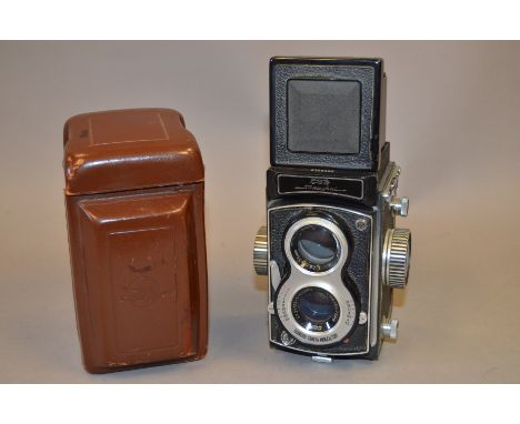 A Shanghai TLR Camera, with 7.5cm f/3.5 lens, shutter working, body G, elements G, in leather case 